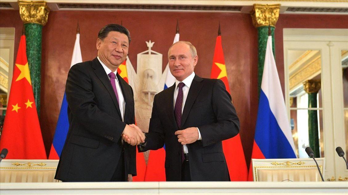 Russia, China call for stronger ties to counter US pressure at Beijing talks