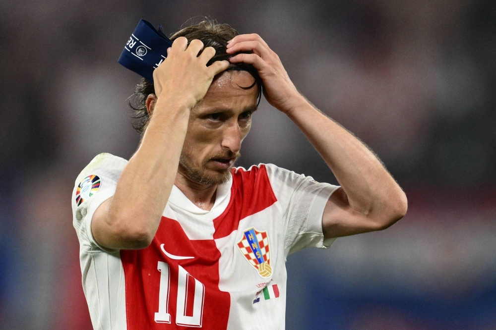 Croatia's midfielder #10 Luka Modric prepares to be substituted during the UEFA Euro 2024 Group B football match between the Croatia and Italy at the Leipzig Stadium in Leipzig on June 24, 2024. (Photo by Christophe SIMON / AFP)