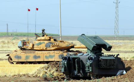 A Turkish soldier on a tank is seen during a military exercise near the Turkish-Iraqi border in Silopi, Turkey, September 19, 2017. (Reuters Photo)
