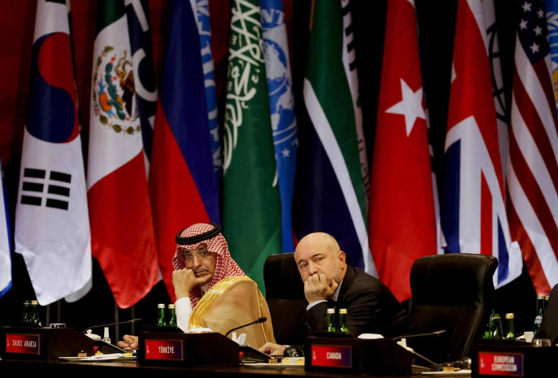 Saudi Arabia's Finance Minister Mohammed Al-Jadaan (L) and Raci Kaya, a delegate from Türkiye, attend a plenary session during the G-20 leaders' summit in Bali, Indonesia, Nov. 16, 2022. (EPA File Photo)