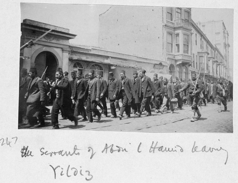 Young Turk soldiers escorting servants in Yildiz Palace after the coup against Sultan Abdulhamid II, Istanbul, Türkiye, April 1, 1909 (Photo via Gertrude Bell)