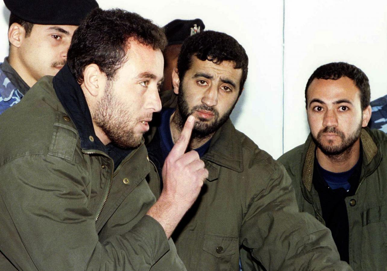 (L-R) Raed al-Attar, Mohammed Abu Shammala and Osama Abu Atah from Hamas, stand before a Palestinian Authority court in Gaza in this February 27, 1999 file photo.  REUTERS/Suhaib Salem