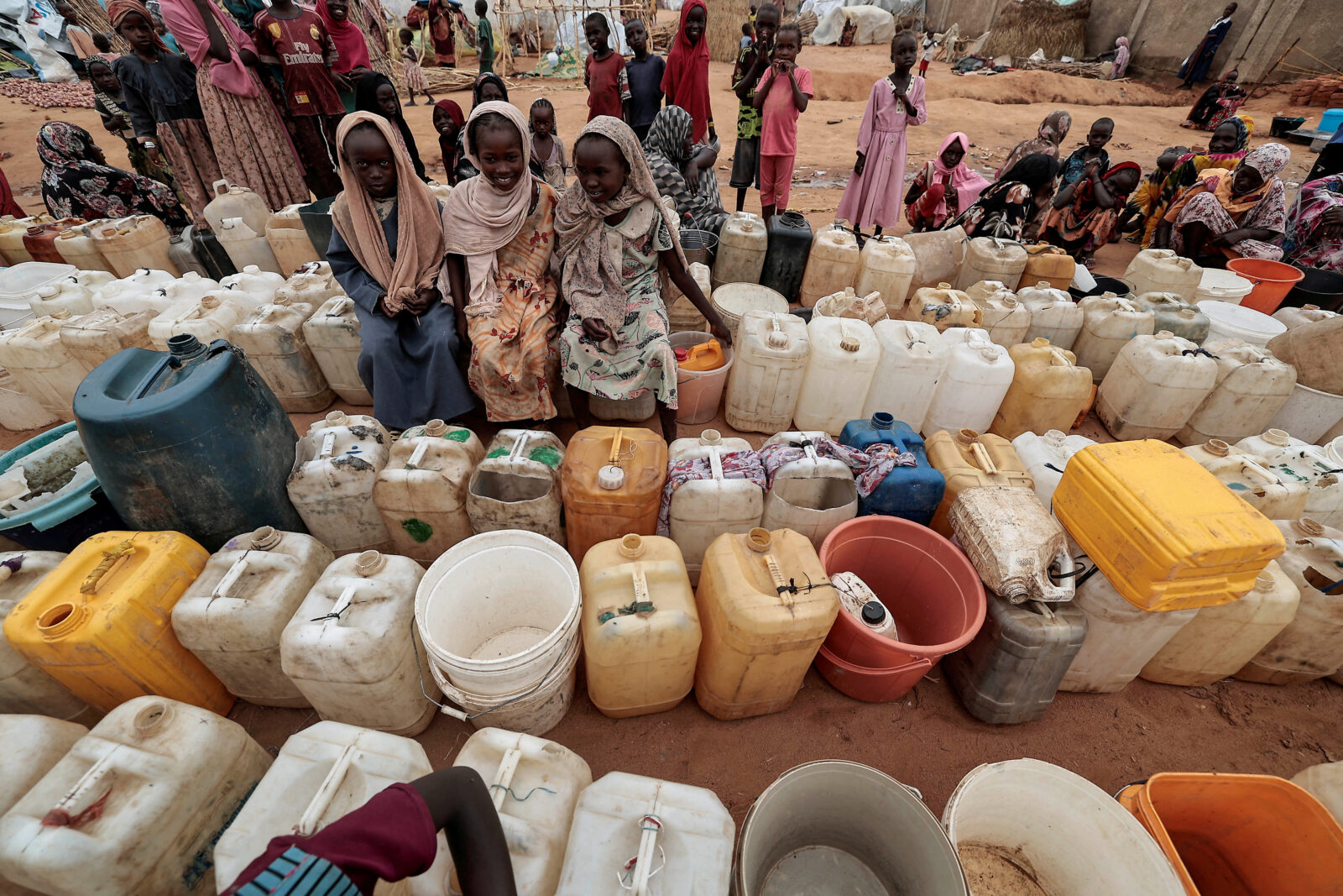 Sudanese girls who fled the conflict in Geneina, in Sudan's Darfur region, line up at the water point in Adre, Chad July 30. (Reuters/Zohra Bensemra Photo)