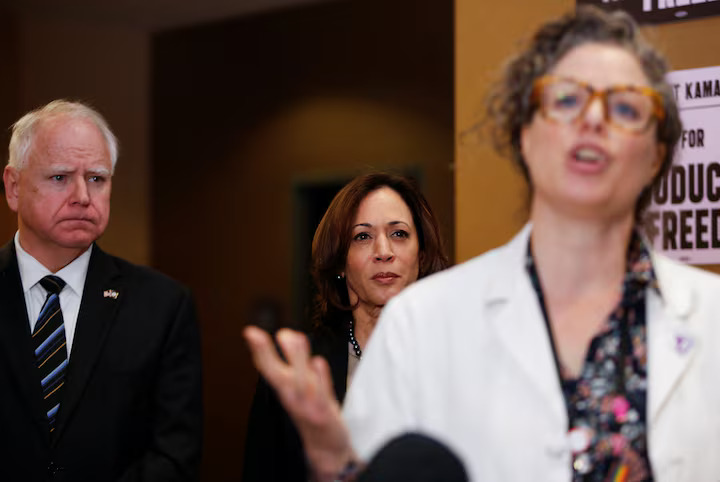 US Vice President Kamala Harris (R) and Minnesota Governor Tim Walz (L) listen to Dr. Sarah Traxler (C) as Harris visits the St. Paul Health Center, a clinic that performs abortions, in St. Paul, Minnesota, U.S., March 14, 2024. (Reuters Photo)