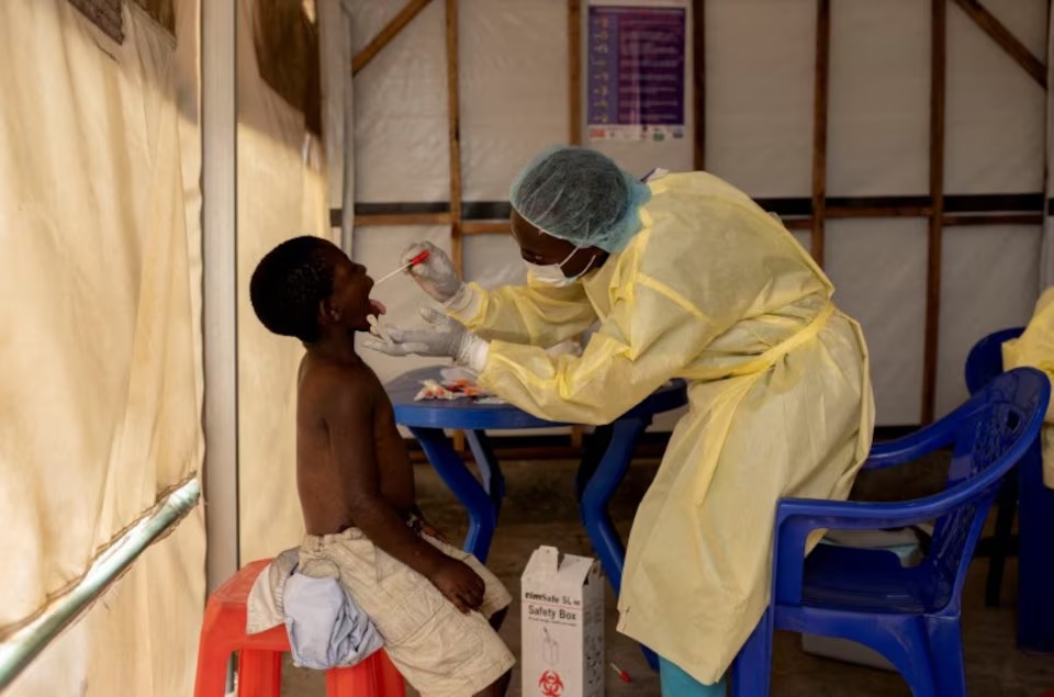 A laboratory nurse takes a sample from a child declared a suspected case Mpox at a treatment centre in Munigi, Democratic Republic of the Congo July 19, 2024, (Reuters Photo)