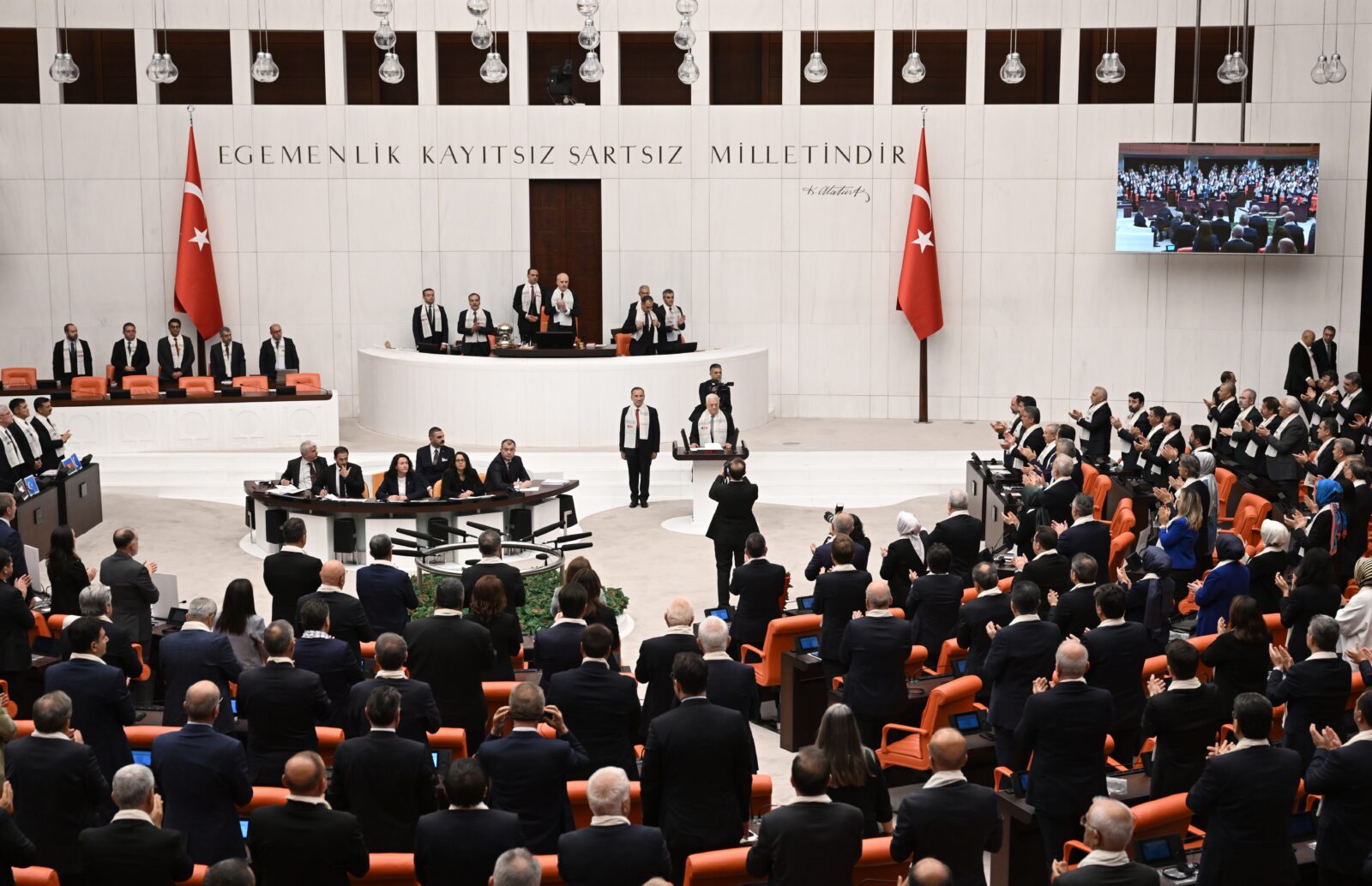 Turkish Members of Parliament warmly applaud as Palestinian President Mahmoud Abbas starts to make a statement during the Extraordinary Meeting on Palestine at the Grand National Assembly of Turkiye in Ankara, Turkiye on August 15, 2024. (AA Photo)