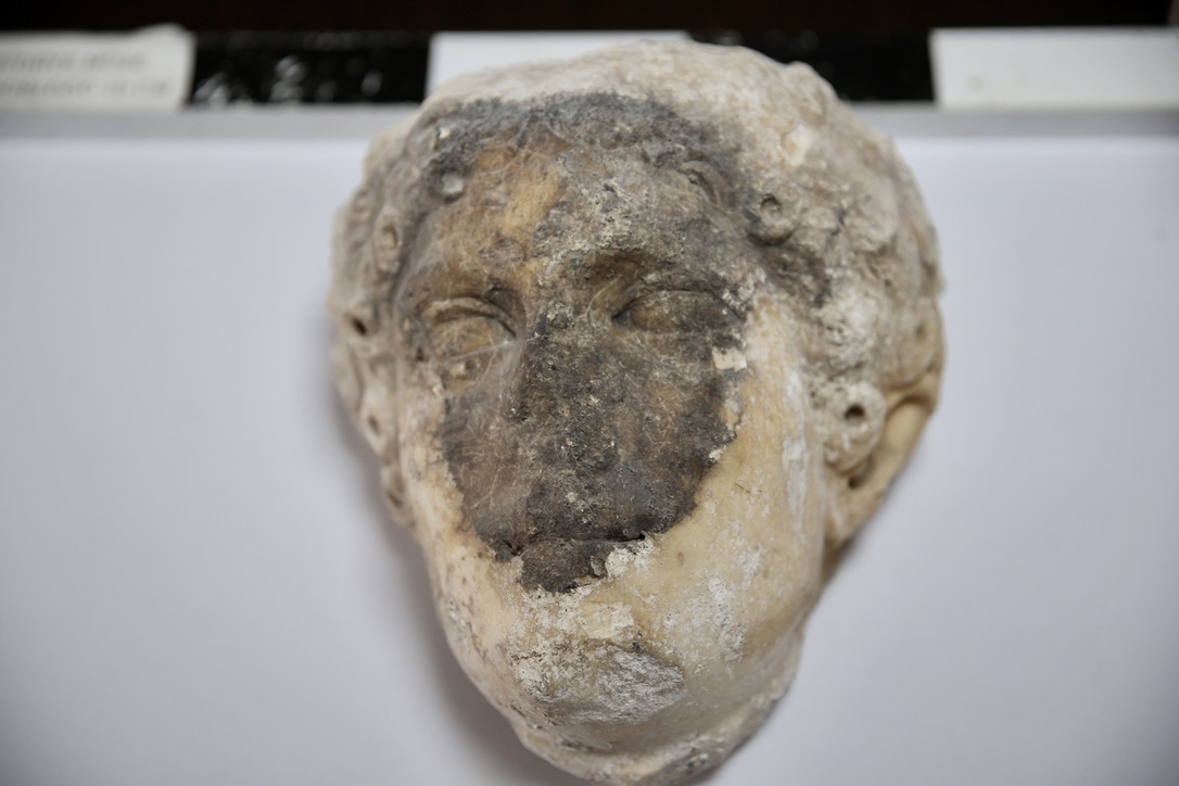 A statue head believed to belong to Apollo is discovered during the excavation of Fethiye Castle in Mugla, Türkiye, August 20, 2024. (AA Photo)