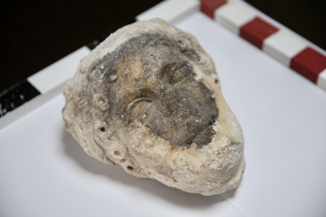 A statue head believed to belong to Apollo is discovered during the excavation of Fethiye Castle in Mugla, Türkiye, August 20, 2024. (AA Photo)