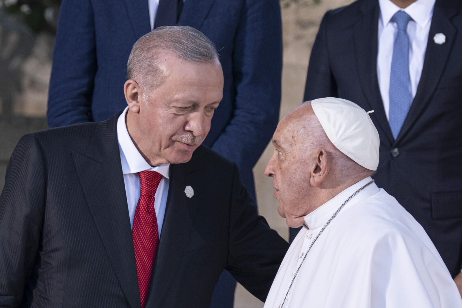 President Recep Tayyip Erdogan (L) speaks with Pope Francis, at a family photo after attending the G7 summit in Apulia, Italy, June 14, 2024. (AA Photo)
