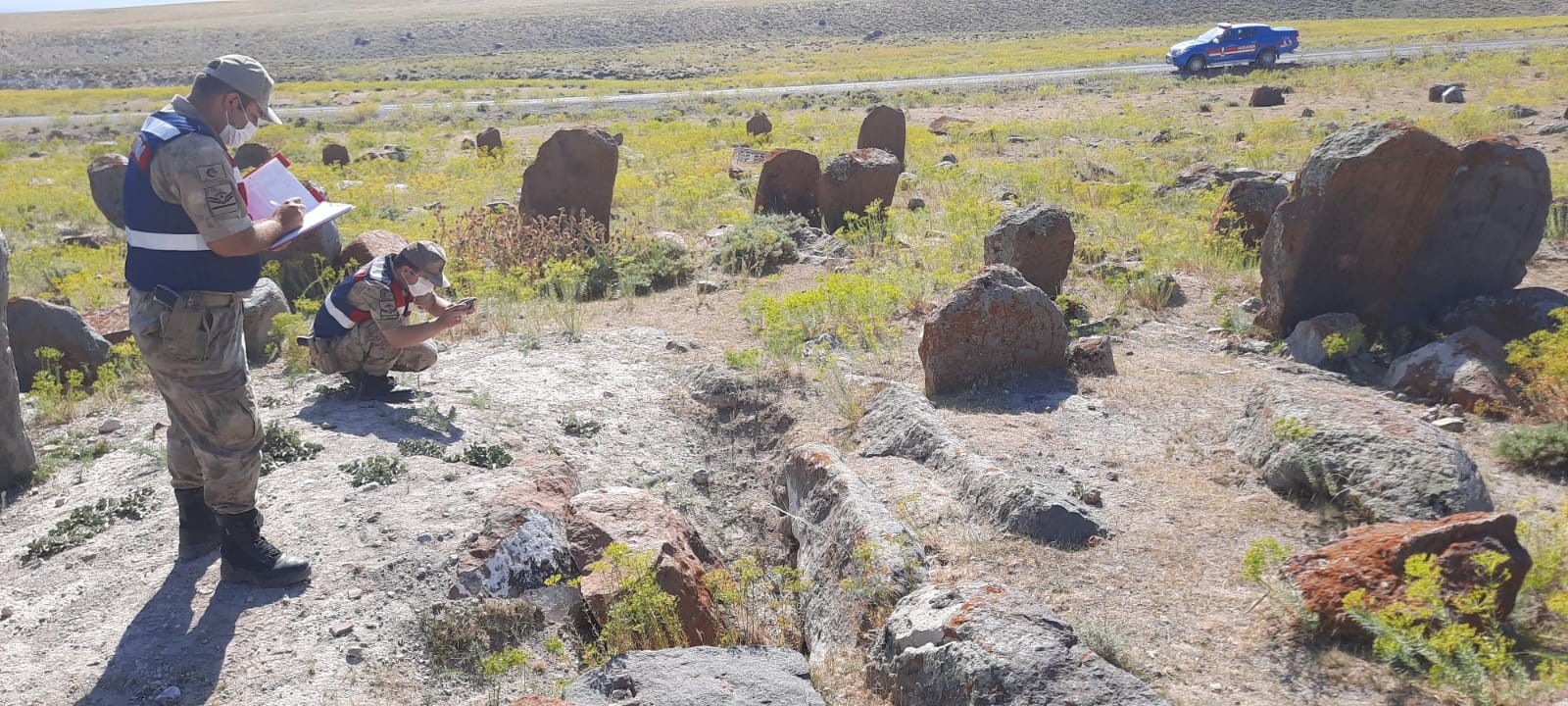 Law enforcement officers examine the scene of an illegal excavation at the Armenian cemetery in Igdir, Türkiye, August 10, 2020 (IHA Photo)
