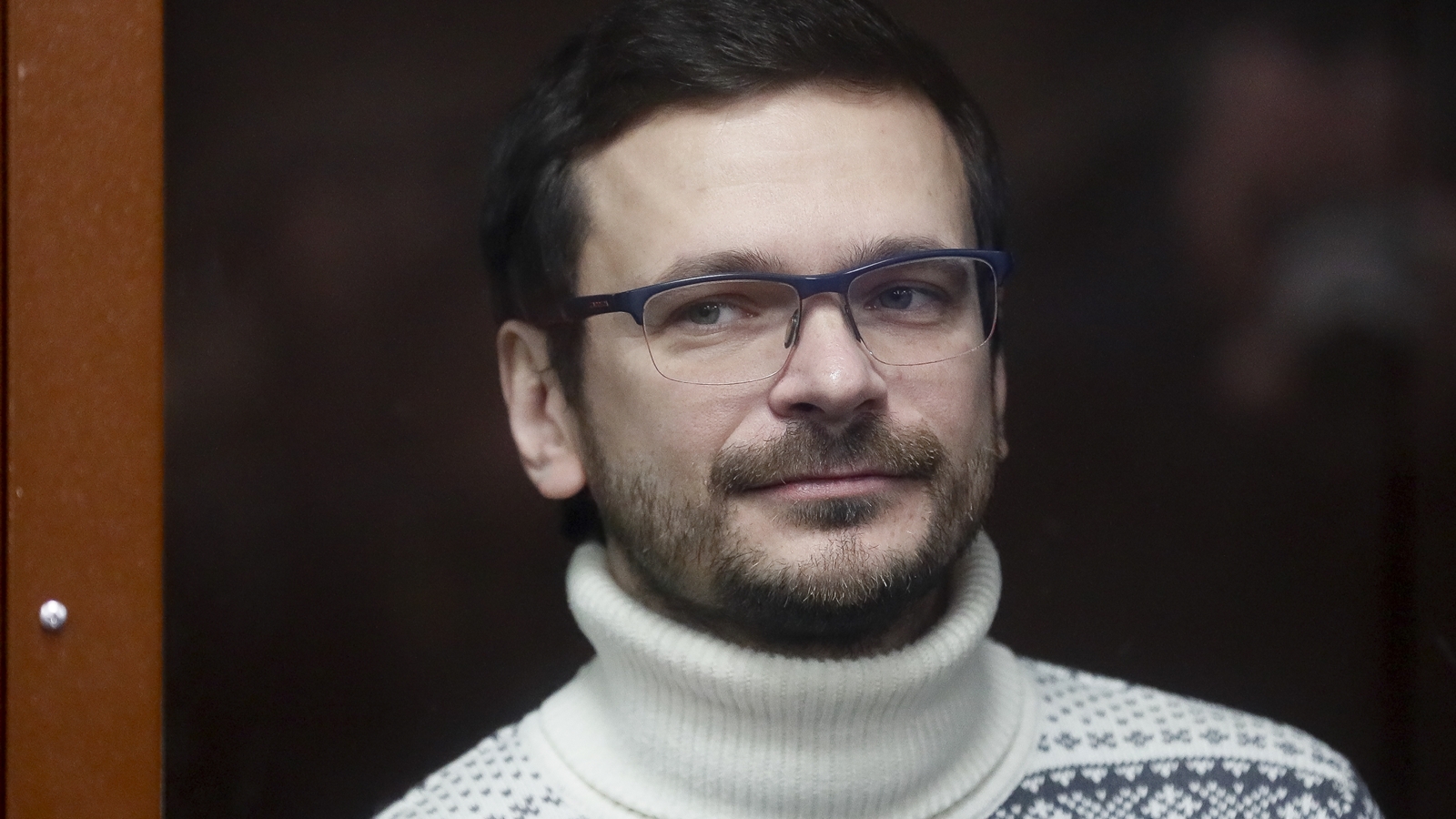 FILE - Russian opposition activist and former municipal deputy of the Krasnoselsky district Ilya Yashin stands inside a glass cubicle in a courtroom prior to a hearing in Moscow, Russia, Friday, Dec. 9, 2022. (Yury Kochetkov/Pool Photo via AP, File)