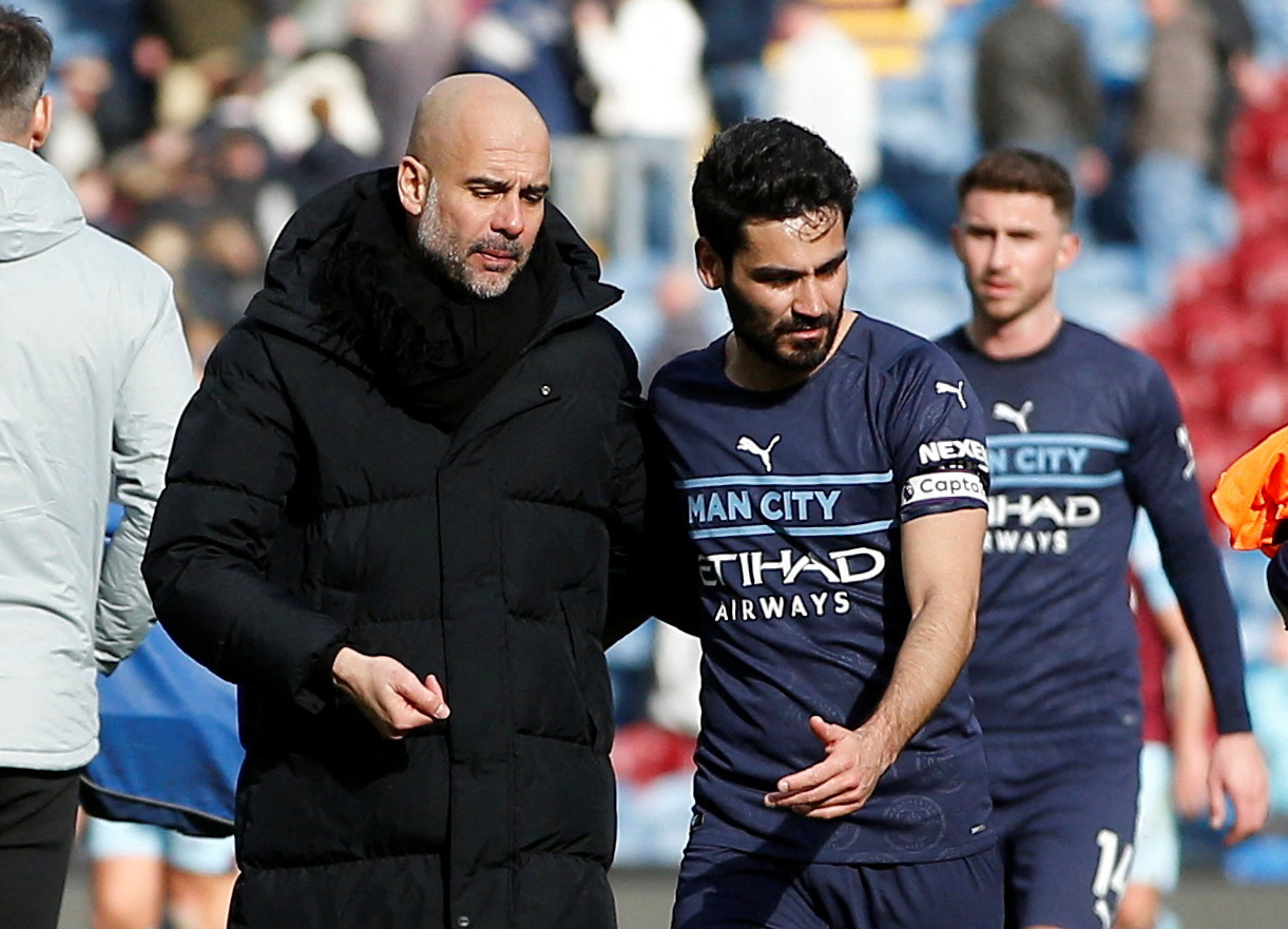 FILE PHOTO: Soccer Football - Premier League - Burnley v Manchester City - Turf Moor, Burnley, Britain - April 2, 2022 Manchester City manager Pep Guardiola with Ilkay Gundogan after the match REUTERS/Craig Brough