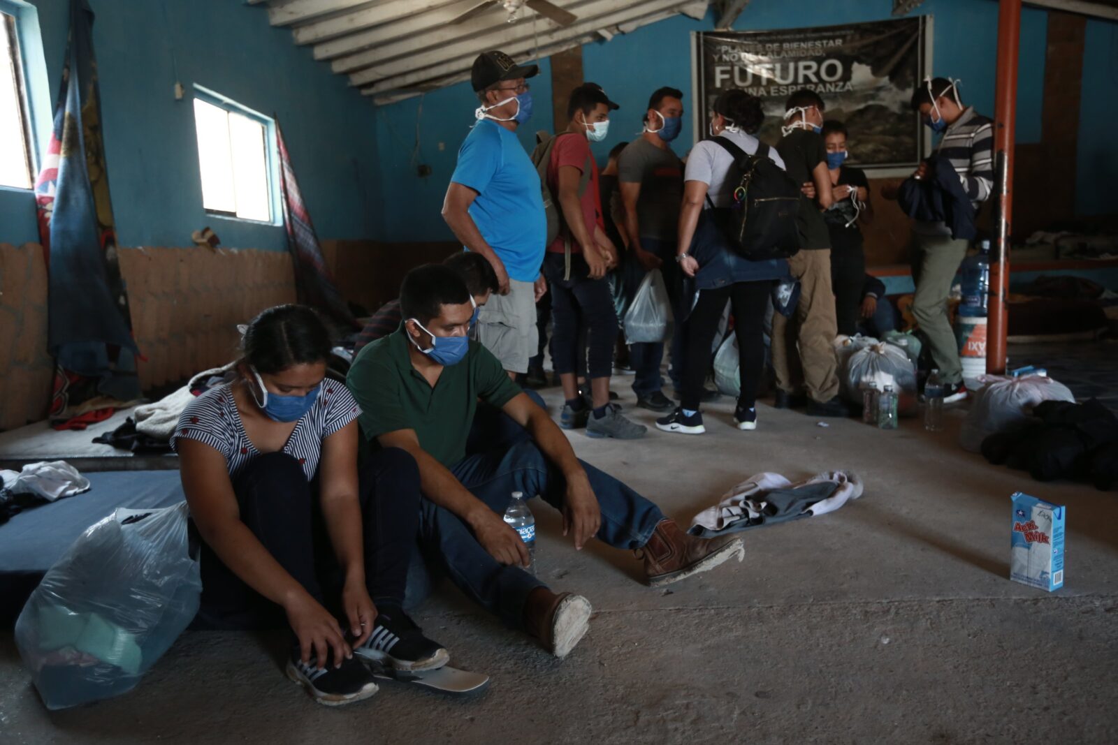Authorities allow migrants to prepare before being escorted out of a house controlled by human smugglers, Ciudad Juarez, Mexico, July 3, 2021. (AP Photo)