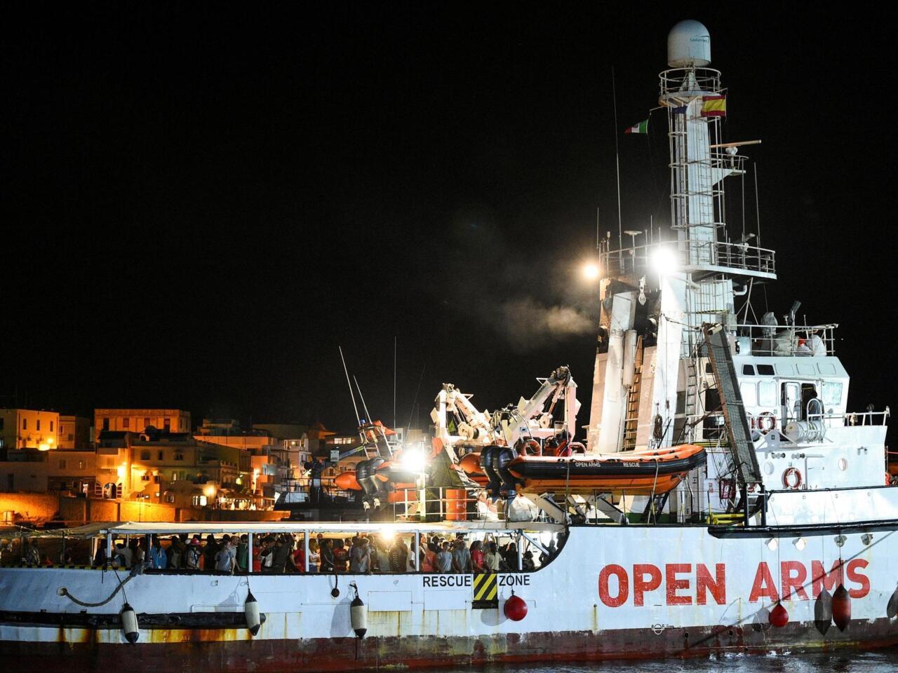 Spanish humanitarian vessel the Open Arms when it was allowed to dock at the Italian island of Lampedusa late Tuesday, 20 August 2019. (Reuters/Guglielmo Mangiapane)