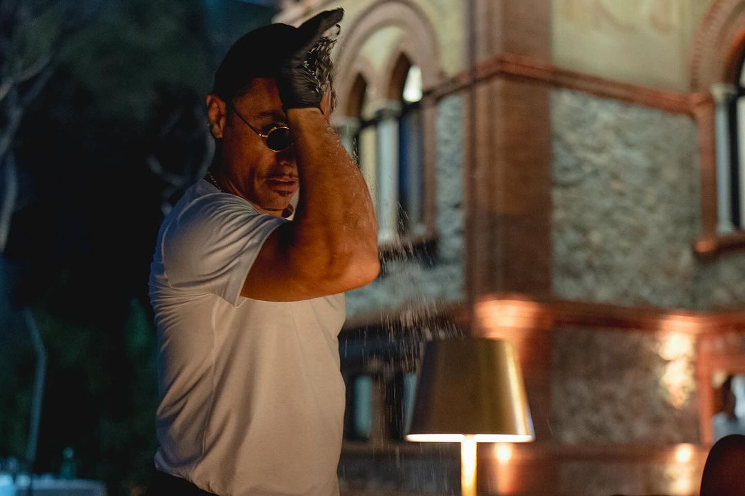 Nusret Gokce, famously known as "Salt Bae," performing his iconic salt-sprinkling gesture during his private dinner at Villa Alpebella, Forte dei Marmi, Italy. (Photo via Instagram / @alpemare_fortedeimarmi)