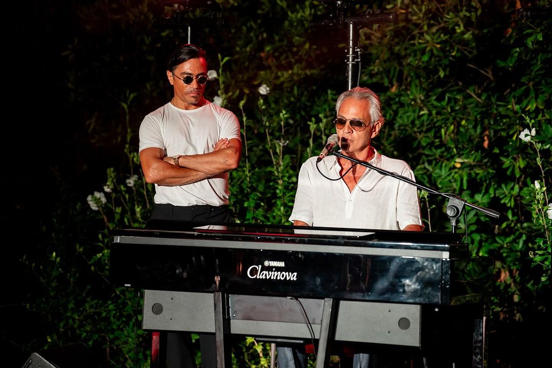 Andrea Bocelli performs a song on the piano as Nusret Gokce looks on during the private event at Villa Alpebella, Forte dei Marmi, Italy. (Photo via Instagram / @alpemare_fortedeimarmi)