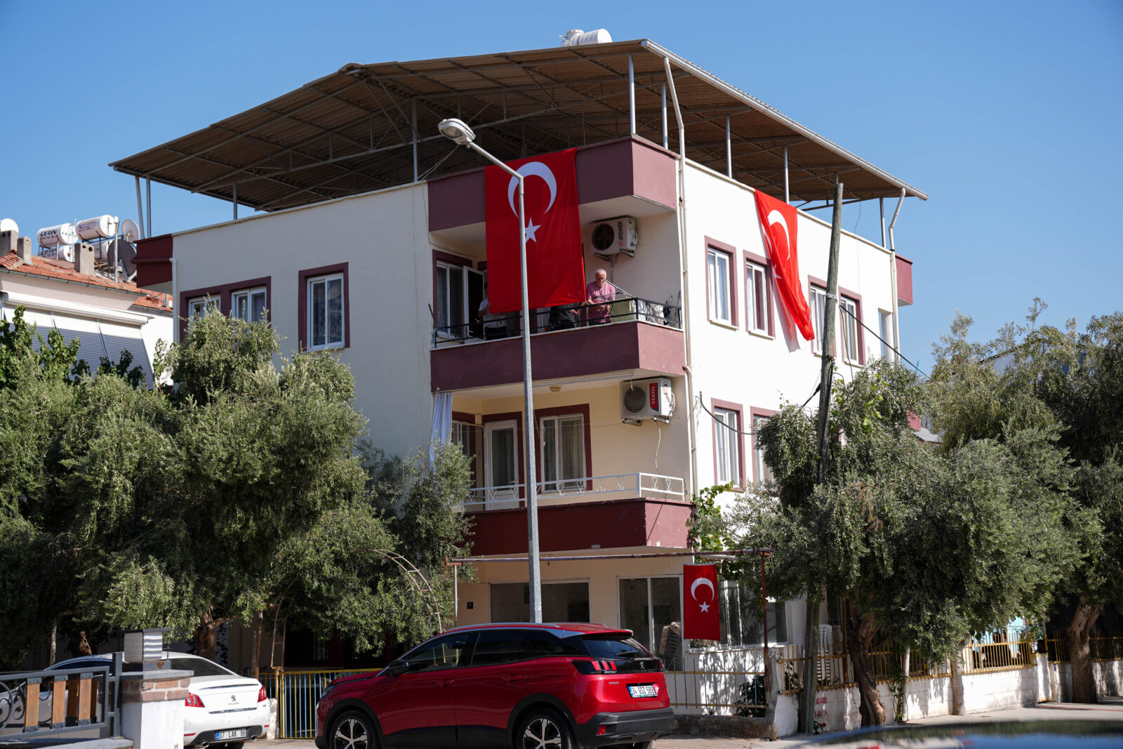 Turkish flags are hung on the grandfather's house of Turkish-American activist Aysenur Ezgi Eygi, who was killed by Israeli forces in West Bank, in Didim district of Aydin, Turkiye on Sep. 07, 2024. (AA Photo)
