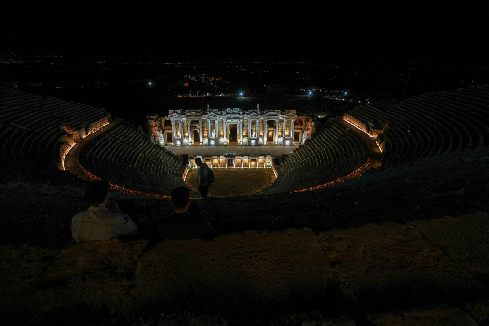Tourists visit the theater of the ancient city of Hirerapolis at the UNESCO World Heritage Site of Pamukkale during busy night museology tourism season in Denizli, Türkiye, May 27, 2024. (AA Photo)