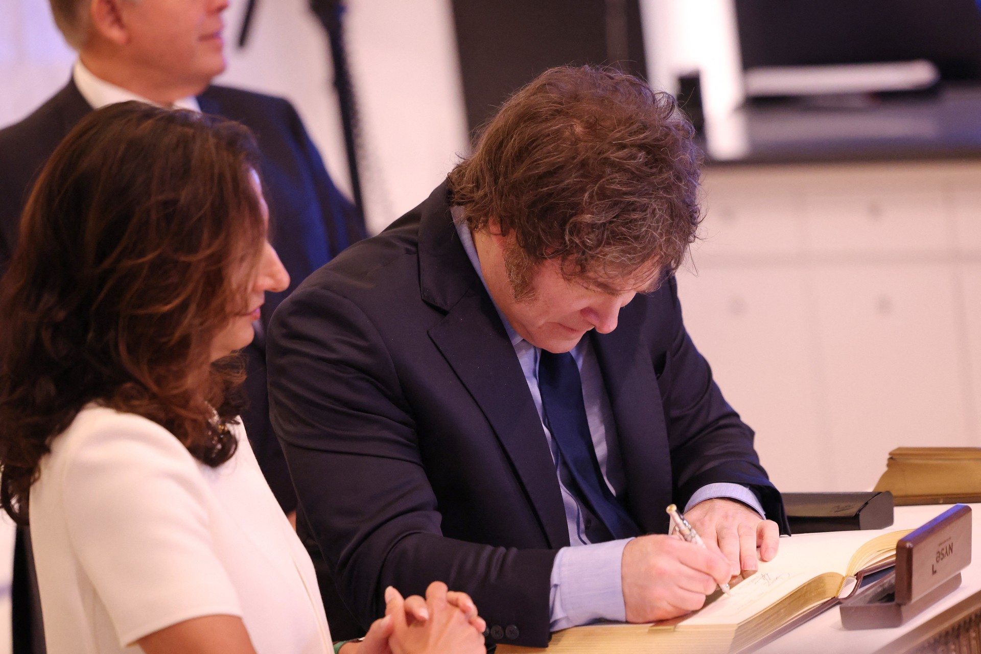 Javier Milei, President of Argentina, signs the guest book at the New York Stock Exchange during morning trading on September 23, 2024. (AFP Photo)