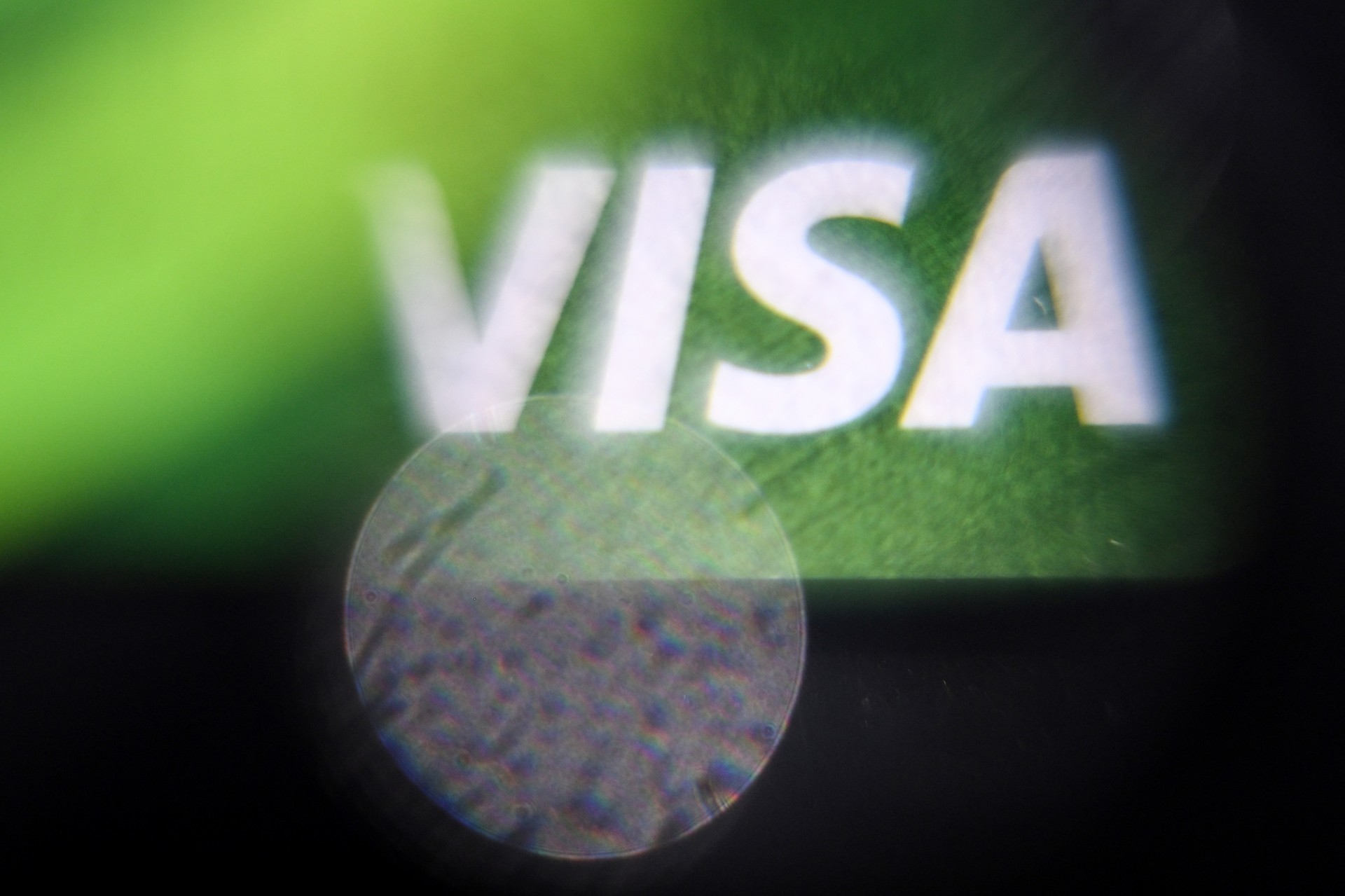 A photo shows the logo of Visa payment system on a bank card in Moscow, taken on March 14, 2022. (AFP Photo)