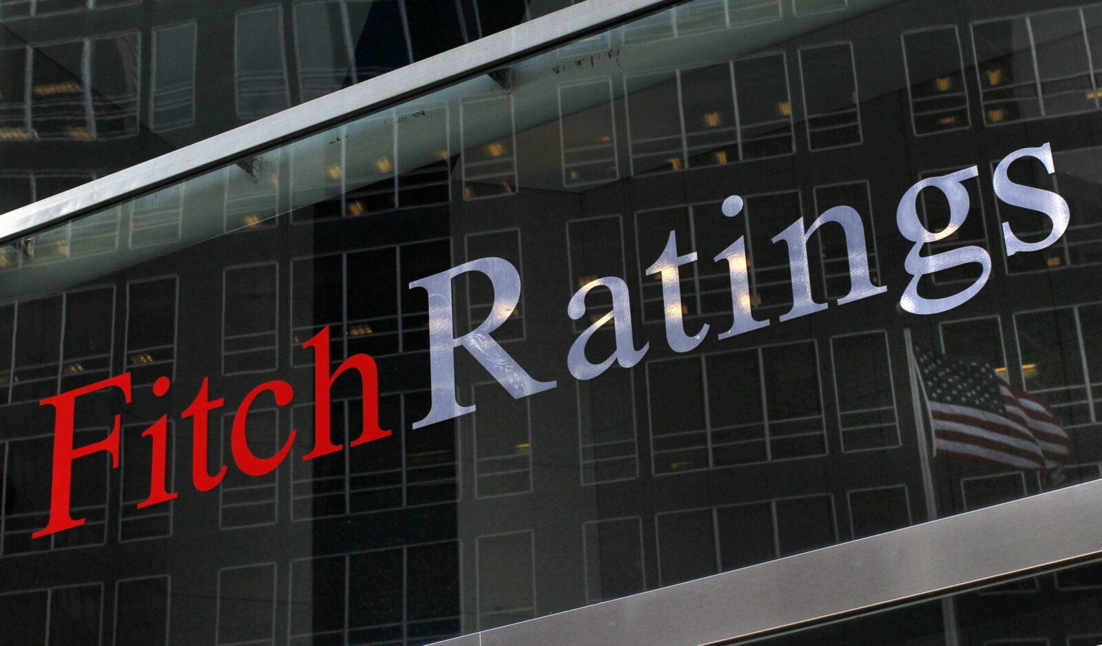 A flag is reflected on the window of the Fitch Ratings headquarters in New York in this February 6, 2013, file photo. Fitch Ratings warned on October 15, 2013, it could cut the sovereign credit rating of the United States from AAA citing the political brinkmanship over raising the federal debt ceiling. (Reuters Photo)Signage is seen outside the Moody's Corporation headquarters in Manhattan, New York, U.S., November 12, 2021 (Reuters)The S&P Global logo is seen outside a building in Washington, DC, on July 25, 2019. (AFP Photo)