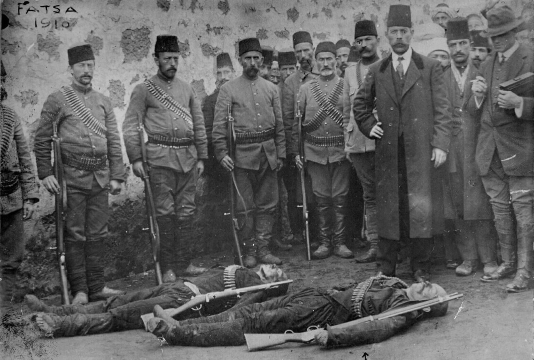 The photo showing Hekimoglu (marked with an arrow on the right) and his comrade Alan Osman on the day they were killed was taken with the camera of the American journalist wearing a fedora seen on the right. (Wikipedia Photo)