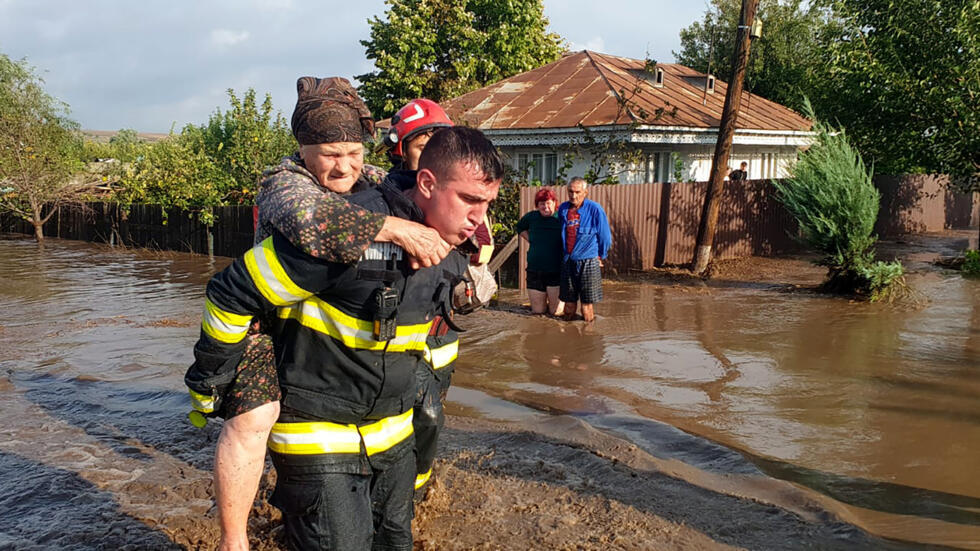 Romanian rescue services said they had rescued hundreds of people across 19 parts of the country. (STR / Romanian Inspectorate for Emergency Situations/AFP) 