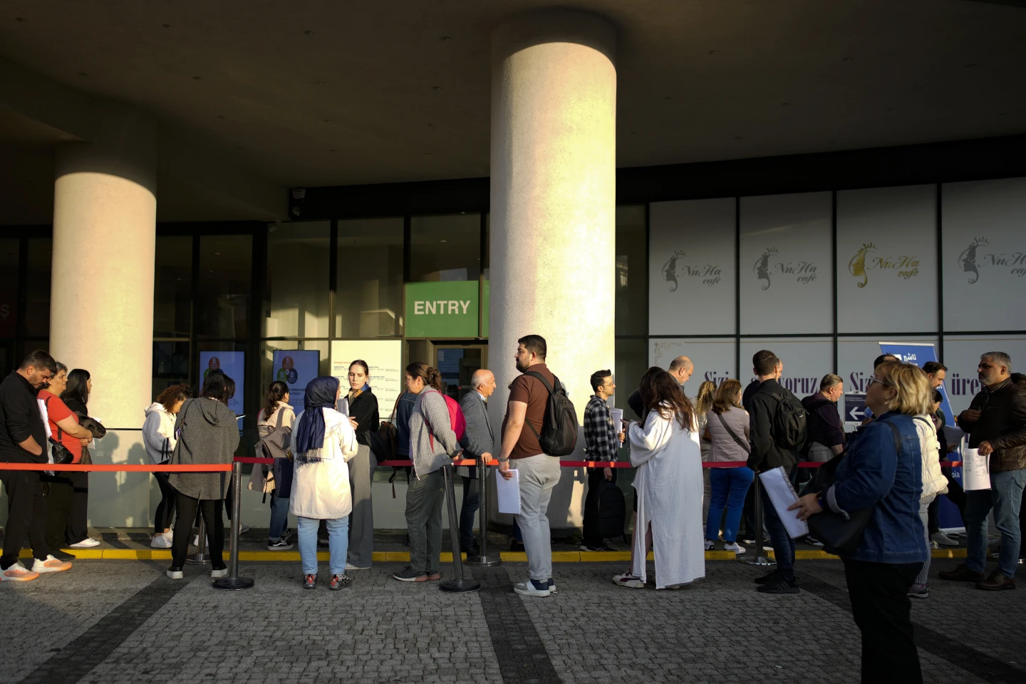 People wait for their turn at a visa application center, in Istanbul, Türkiye, Nov. 3, 2023. (AP Photo/Emrah Gurel)