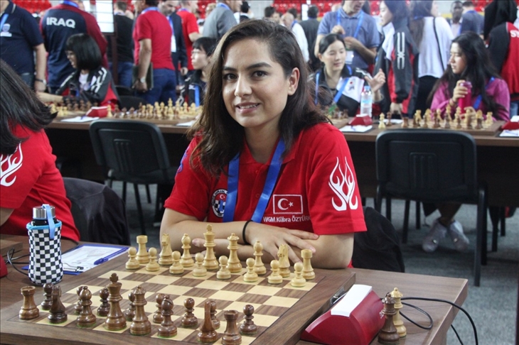 Kubra Ozturk Orenli, posing with a chessboard in Türkiye, proudly representing her achievements in the chess world. July 4, 2021. (AA Photo)