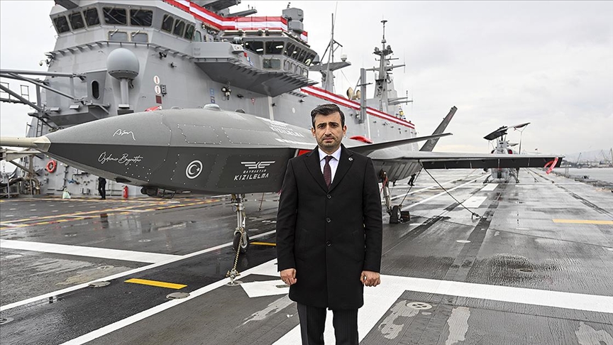 Selcuk Bayraktar on board the TCG Anadolu with Kizilelma fighter UAV. (AA Photo)