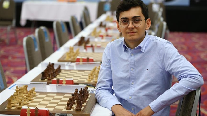 Vahap Sanal, Türkiye's young grandmaster, posing with a chessboard, September 26, 2021. (AA Photo)