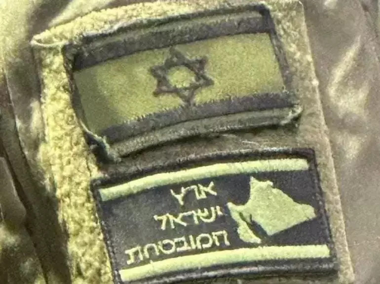 “Promised Land” map on Israeli soldier's arm sparks debate in the world press, 2024 (Photo via X)