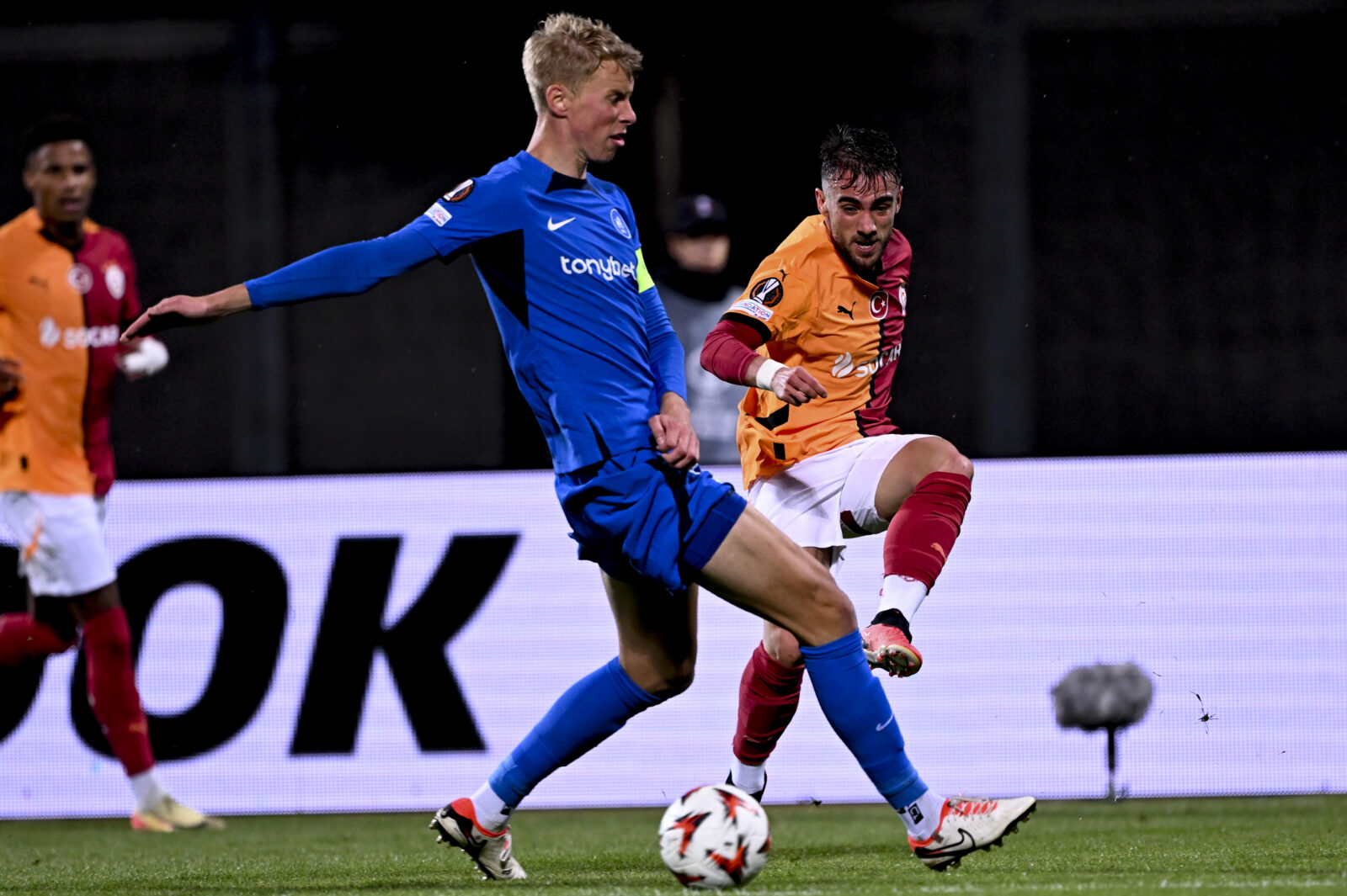 Yunus Akgun (R) of Galatasaray in action against Ziga Lipuscek (front) of RFS during the UEFA Europa League match between RFS and Galatasaray at Daugava Stadium in Riga, Latvia on Oct.3, 2024. (AA Photo)