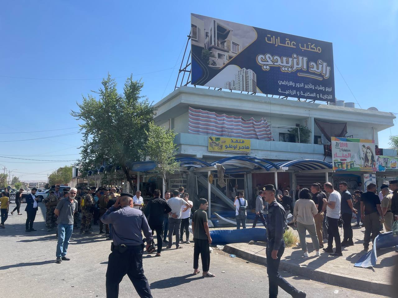 People inspect the area after a bomb attack targeted Saygin Haceroglu, the office manager of the Turkmen House affiliated with the Iraqi Turkmen Front, in the city of Kirkuk, Iraq on October 5, 2024 (Ali Makram Ghareeb - Anadolu Agency)