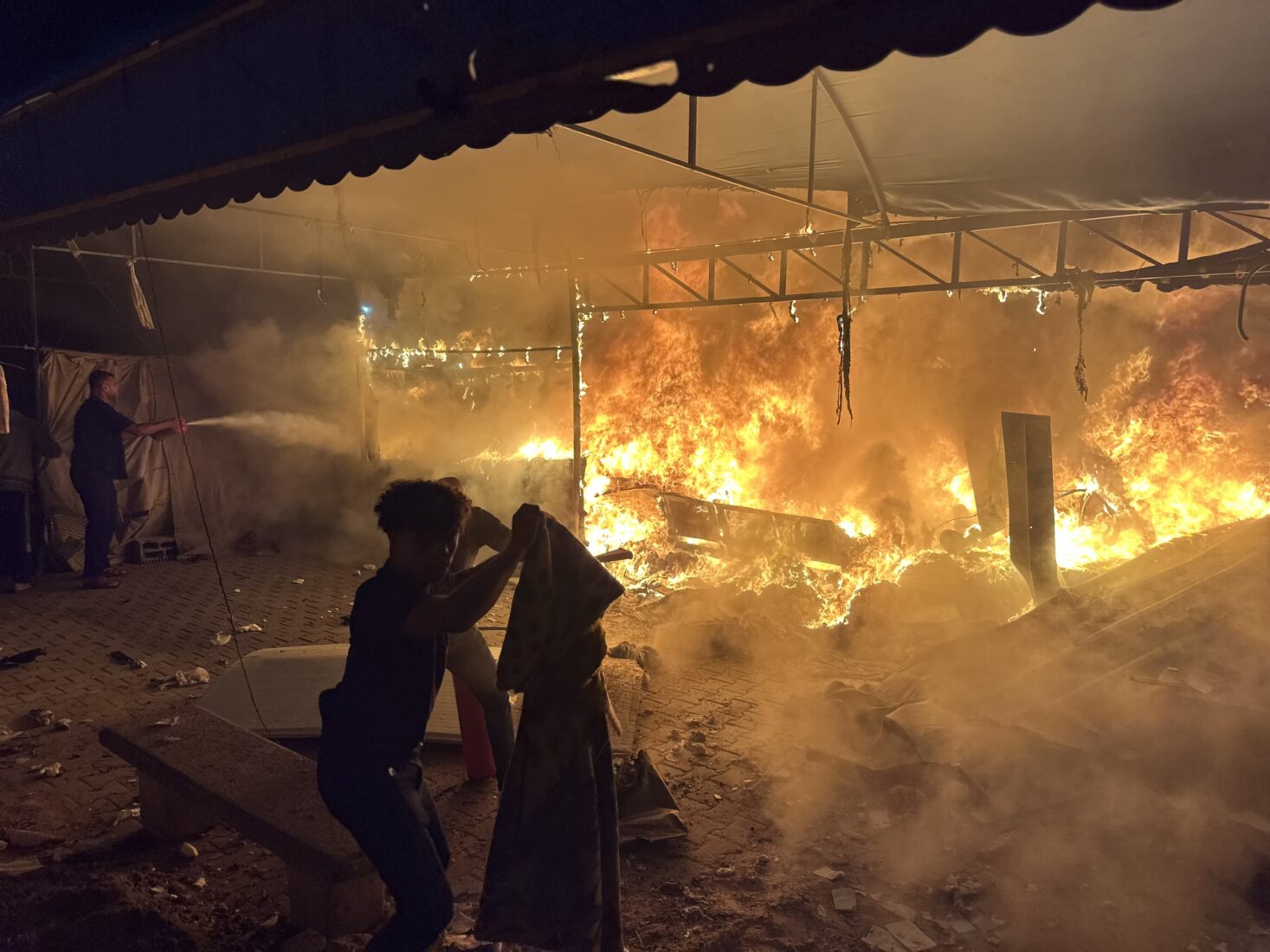 Fire breaks out on tents housing displaced civilians after Israeli attacks in the courtyard of Al-Aqsa Martyrs Hospital in Deir Al Balah, Gaza, October 14, 2024. (AA Photo)