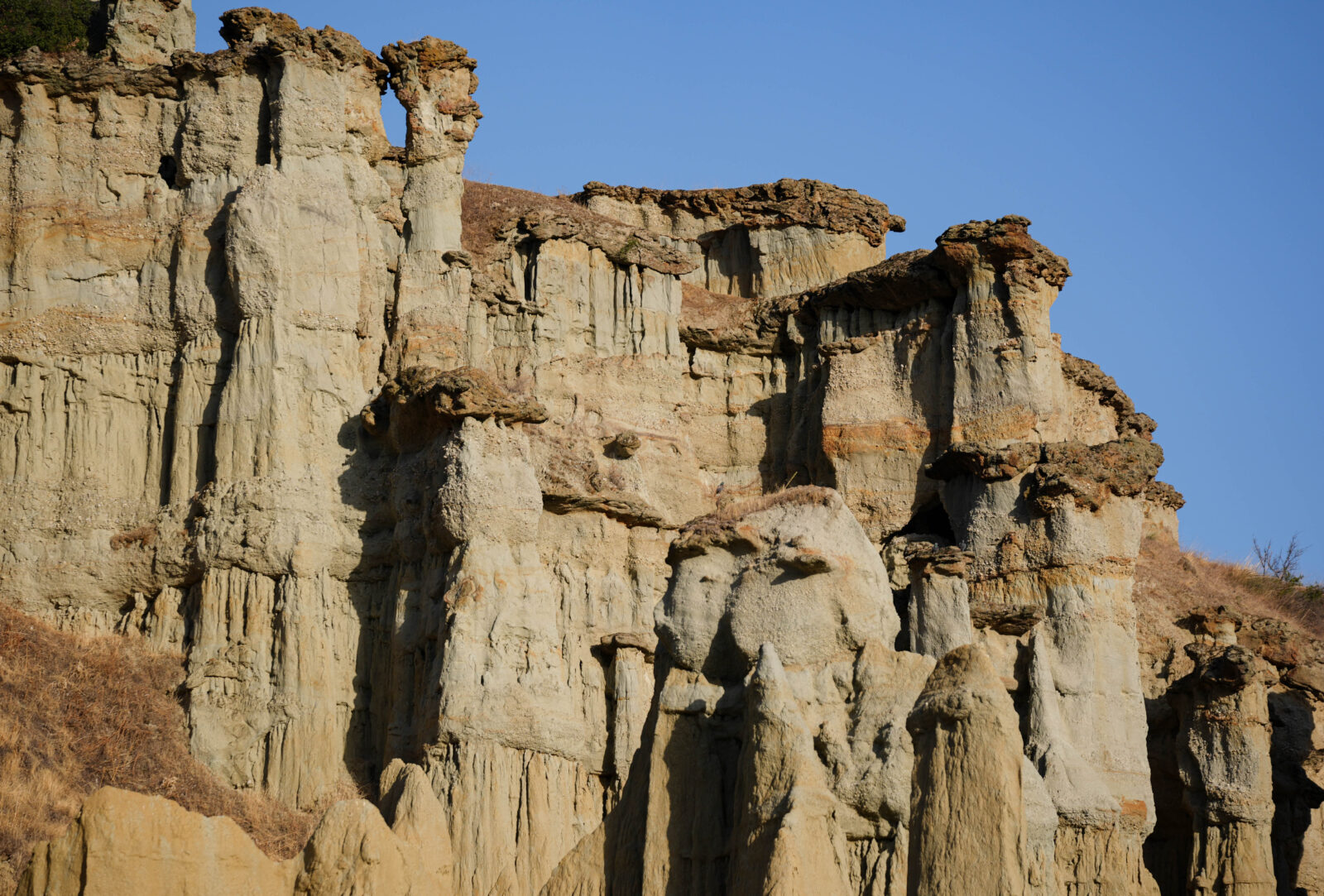 A view of the fairy chimneys formed by rain, erosion and wind eroding soft tuff rocks over millions of years in Kula district, which was called “burnt country” in the past due to its volcanic characteristics in Manisa, Türkiye on Oct. 14, 2024. (AA Photo)