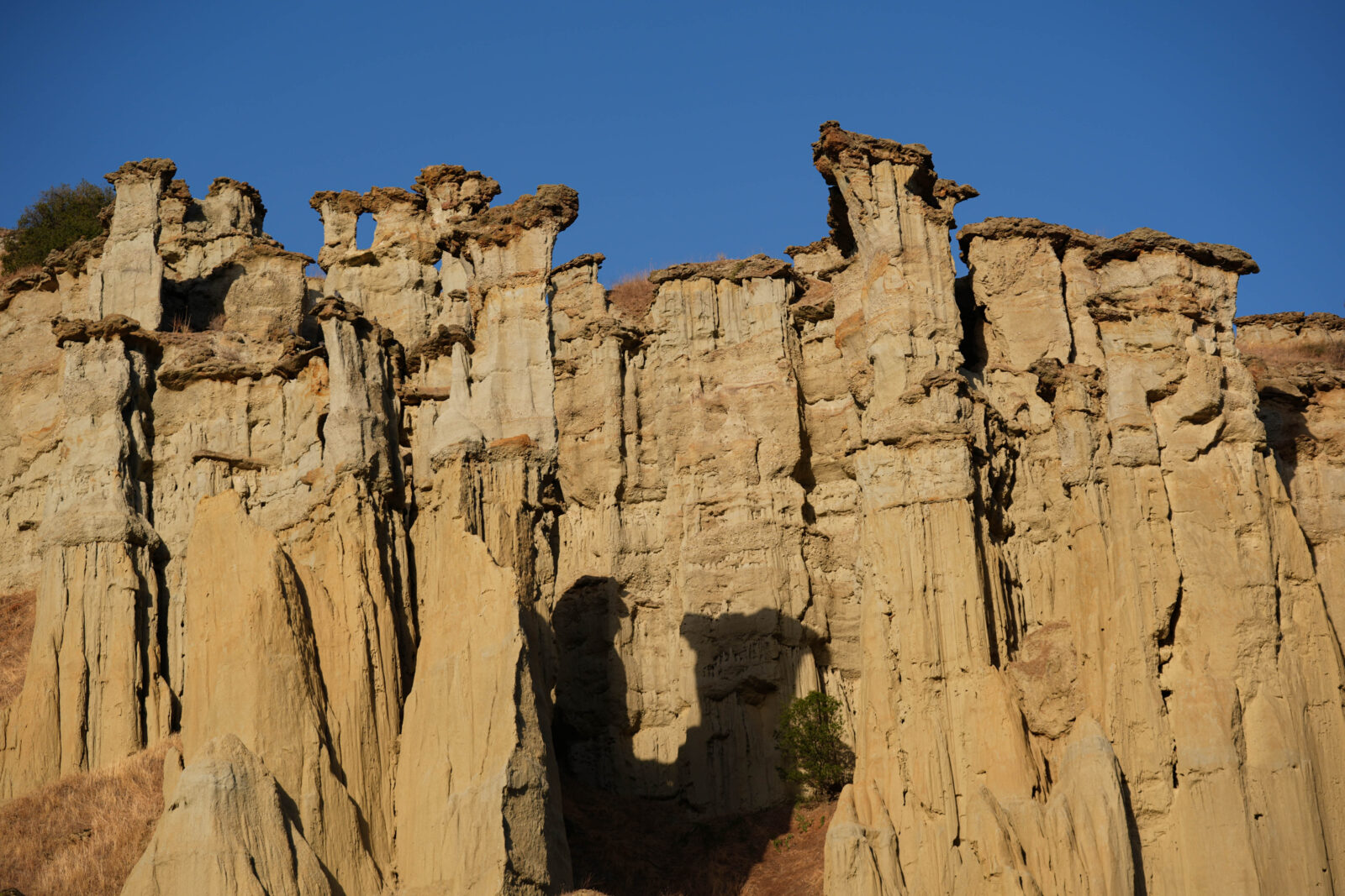 A view of the fairy chimneys formed by rain, erosion and wind eroding soft tuff rocks over millions of years in Kula district, which was called “burnt country” in the past due to its volcanic characteristics in Manisa, Türkiye on Oct. 14, 2024. (AA Photo)