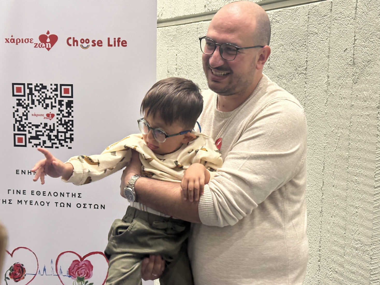 Four-year-old Cagatay Dramali (L), who was given a new lease on life through a stem cell transplant, reunited with his Greek stem cell donor, Aleksandros Apostoludas (R), in Greece, Oct. 15, 2024. (AA Photo)