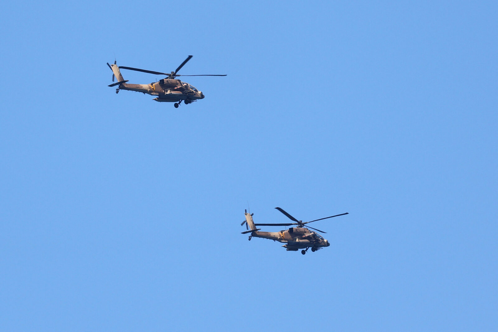 Israeli Apache helicopters fly over the Mediterranean city of Netanya, on October 22, 2024, amid the ongoing war between Israel and Hezbollah. (AFP Photo)