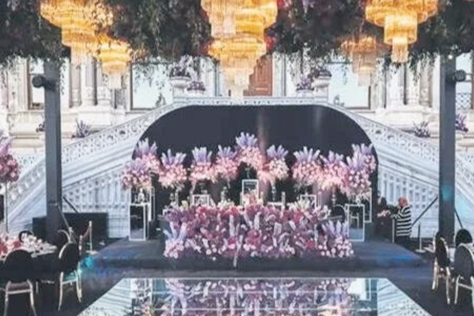 The beautifully decorated wedding stage with vibrant florals and chandeliers for the Tanuri-Tjipto wedding on the Bosphorus in Istanbul, Türkiye, Oct. 26, 2024. (Photo via Türkiye Gazetesi)