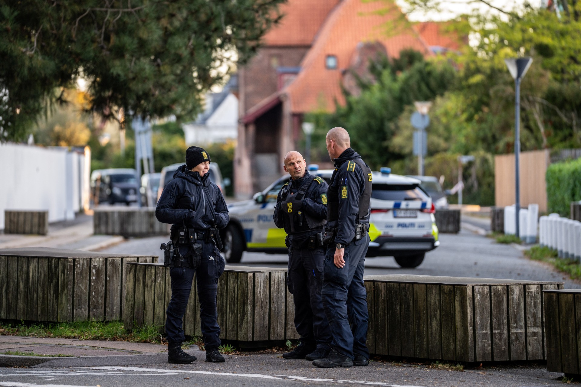 Police officers talk during the investigation of two blasts near the Israeli embassy in Copenhagen, Denmark, October 2, 2024. (Emil Nicolai Helms/Ritzau Scanpix)