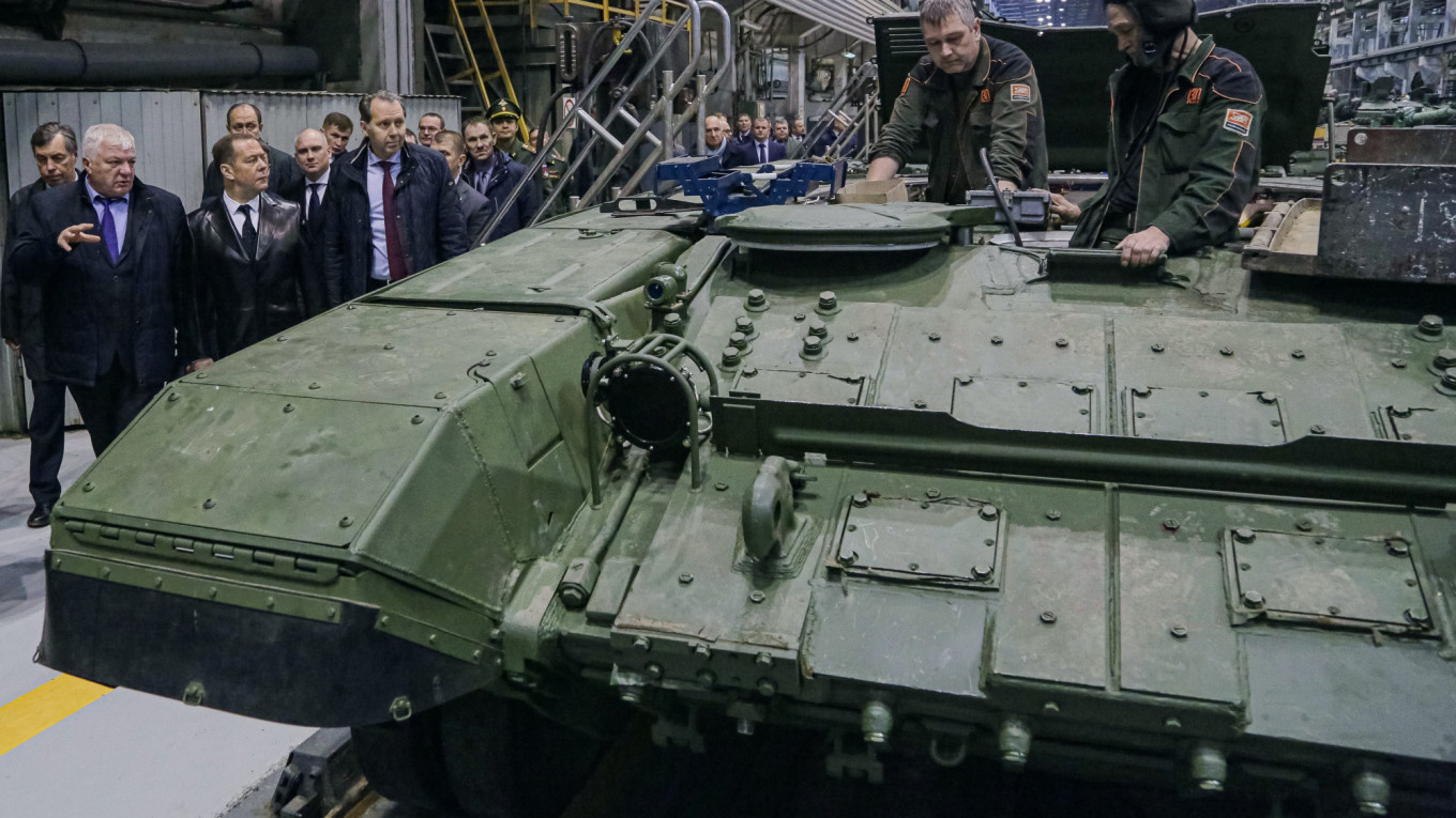 Ex-president Dmitry Medvedev on a visit to Russia's tank producing Uralvagonzavod factory in October. (TASS Photo)