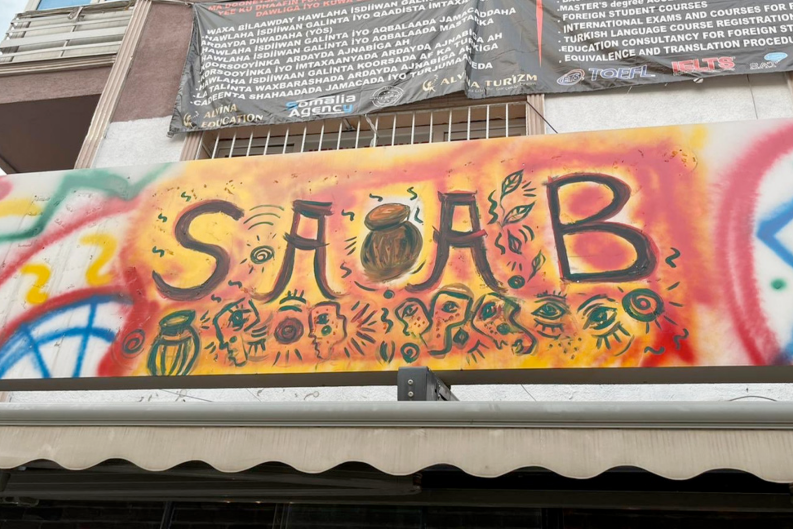 SAAB Cafe's vibrant and symbolic signage, painted in Somali-inspired art, became a point of contention with authorities who ordered it to be covered, Ankara, Türkiye, June 2022. (Photo via Mohamed Isa Abdullahi)
