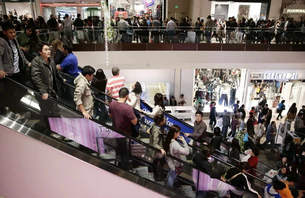 People shop at Macy's department store during Black Friday shopping, New York, US, Nov. 29, 2019. (AP Photo)