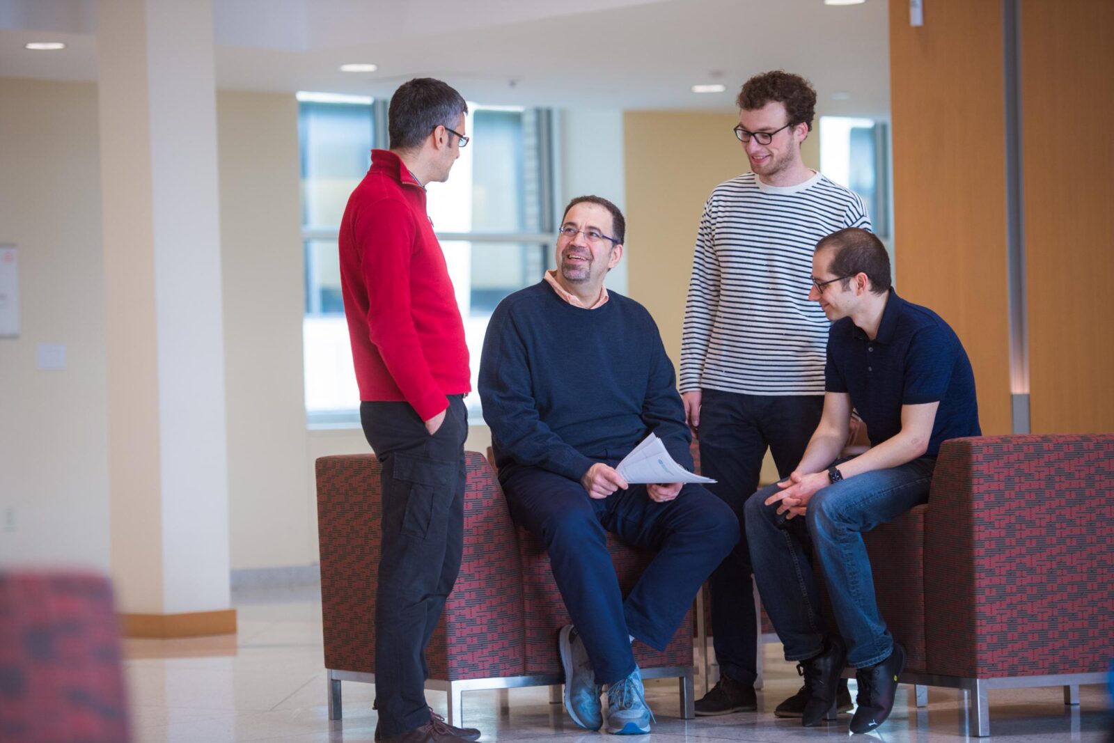 American-Turkish economist Daron Acemoglu, surrounded by peers and students at the Massachusetts Institute of Technology (MIT), Cambridge, United States, January 22, 2008. (Photo via MIT)