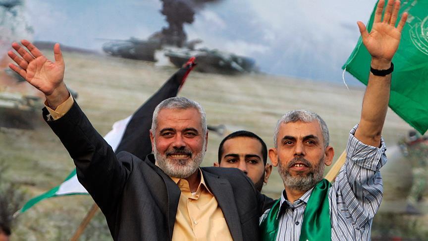 Photo shows Hamas leader Yahya Sinwar (R), whom Israel killed, alongside former Hamas leader Ismail Haniyeh, who was also assassinated by Israel in July 2024, both seen waving their hands. (AA Photo)