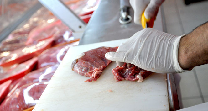 The file photo shows a butcher preparing a piece of red meat on a cutting board. (IHA Photo)