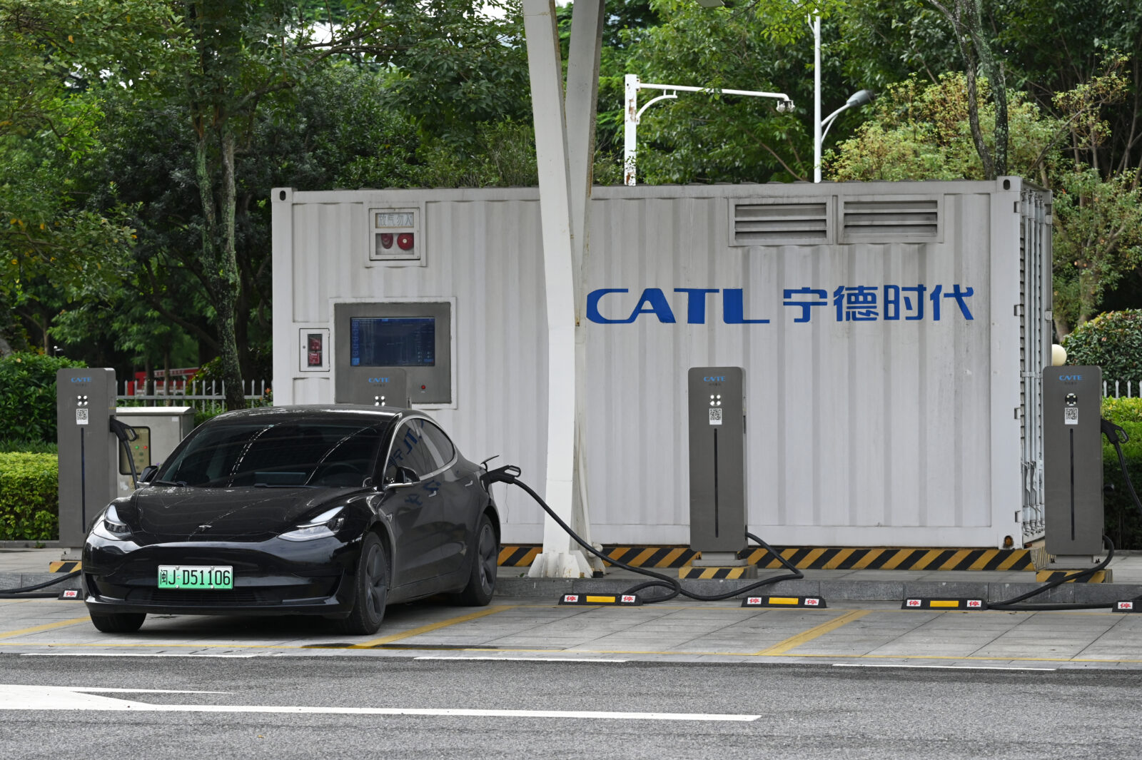 Auto giants Tesla, BMW warn of tariff fallout, predict heavy losses