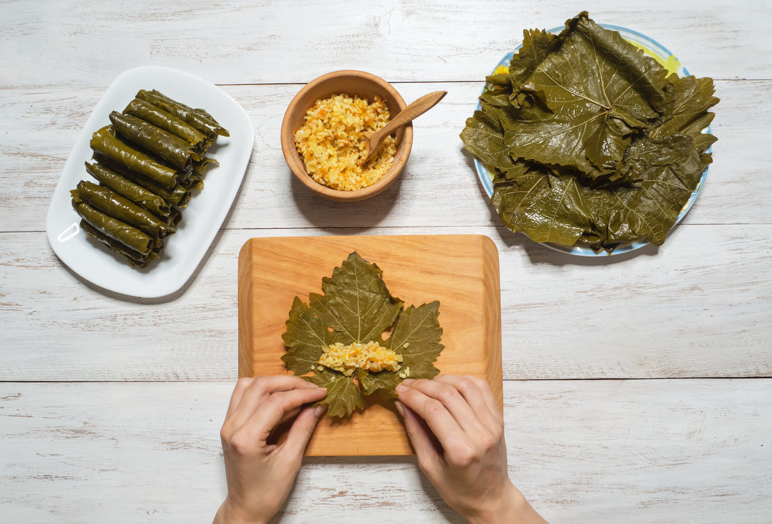 Stuffed grape leaves are carefully rolled with a filling of rice, herbs, and spices—an iconic vegetarian dish in Turkish cuisine. (Adobe Stock Photo)