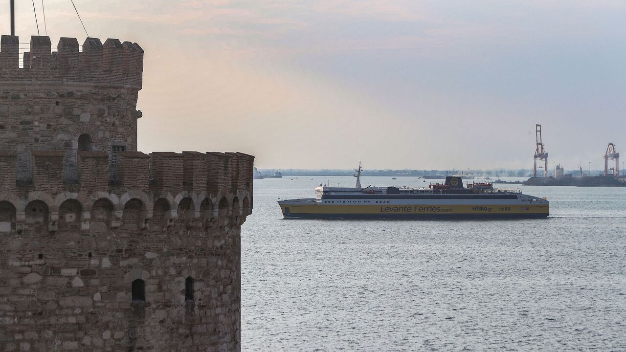 The ferry "Smyrna di Levante" passes next to the White Tower, launching the first-ever service between the northern Greek port city of Thessaloniki and the seaside town of Izmir in western Turkey, on October 10, 2022. - This is the first direct shipping line linking mainland Greece with Turkey. Until now, only some Greek islands in the eastern Aegean have had links, by small boats, with the nearest Turkish ports. (Photo by Sakis MITROLIDIS / AFP) (Photo by SAKIS MITROLIDIS/AFP via Getty Images)
